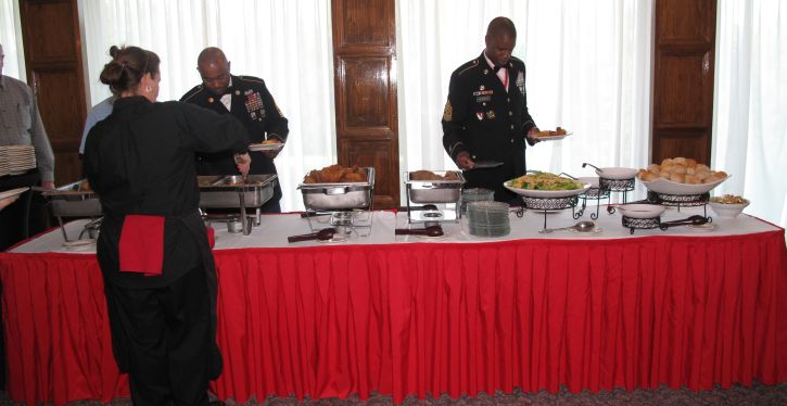 Brigadier General Bryan Watson's representative, CSM Terrance W. Murphy starts the buffet dinner.