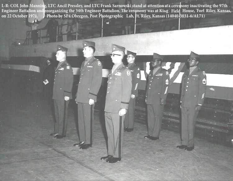 L-R: COL John Manning, LTC Ancil Pressley, and LTC Frank Sarnowski stand at attention at a ceremony inactivating the 97th
Engineer Battalion and reorganizing the 34th Engineer Battalion. The ceremony was at King Field House, Forft Riley, Kansas,
on 22 October 1971