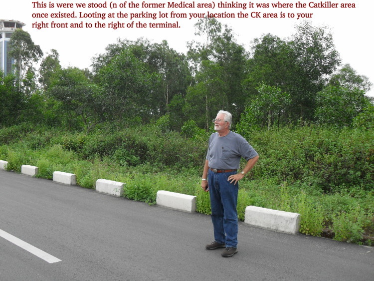 Dennis Currie is standing just north of the Medical Detachment area we thought was the old Catkiller area. Dennis was south of and directly behind the terminal.