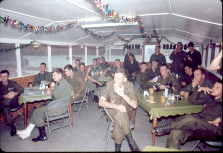 Photo of some officers during a meeting, taken in the 220th Mess Hall