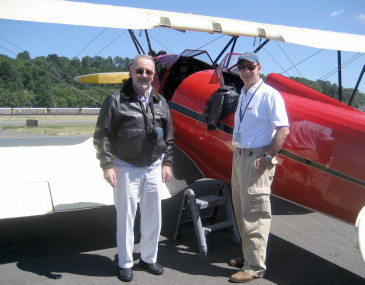 Gene and Ellie Wilson ride in a Bi-Plane